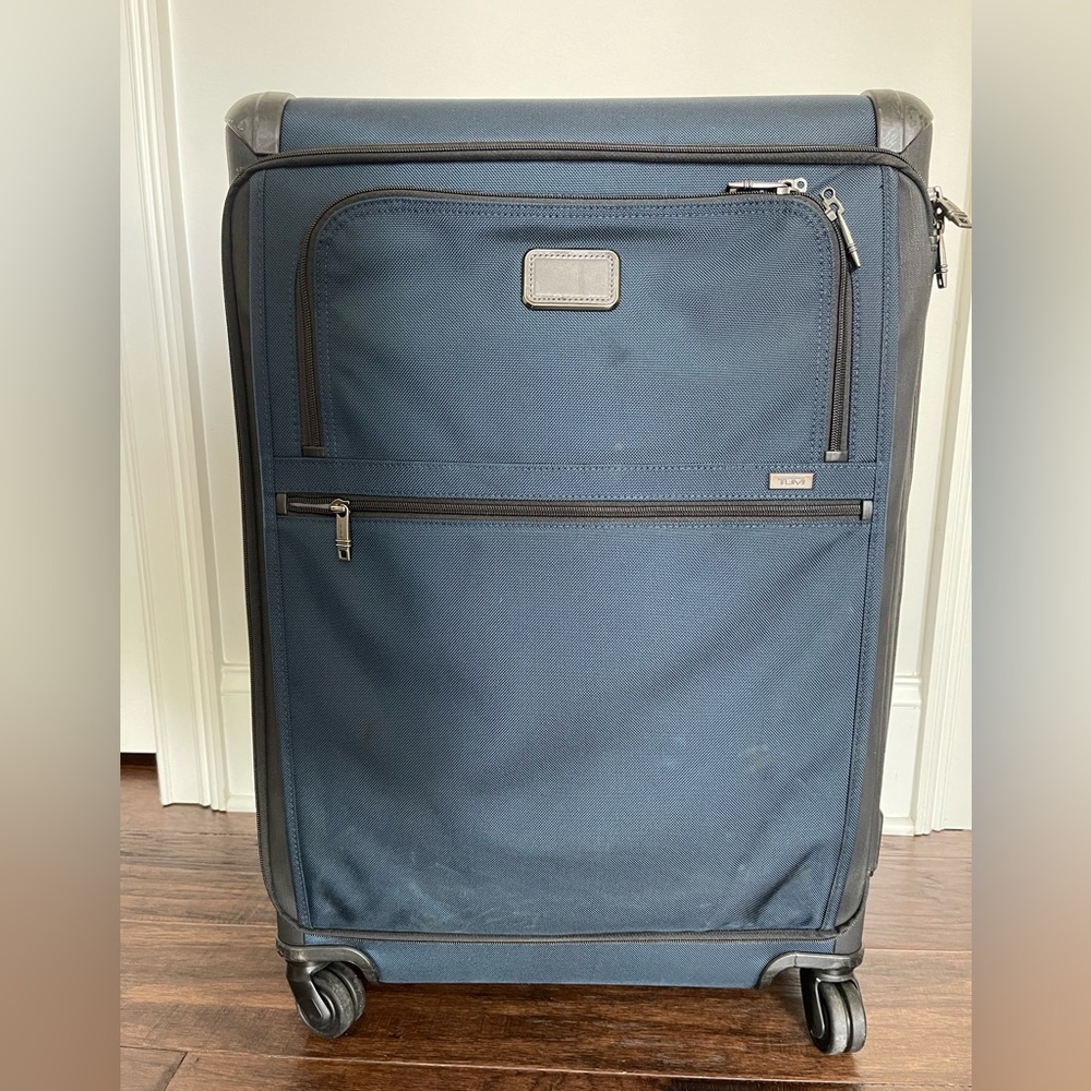 Navy and Black Tumi Extended Trip Expandable 4 Wheeled Packing Case